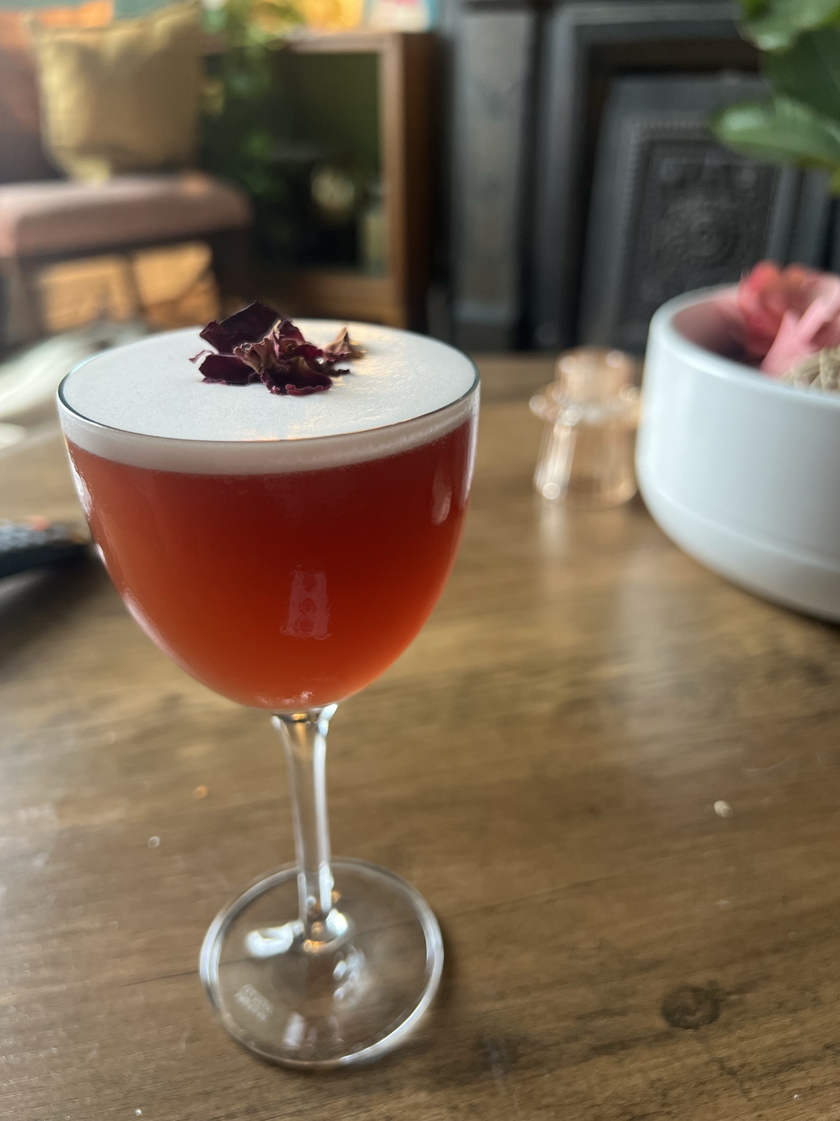 Seasonal mocktail with edible flower garnish